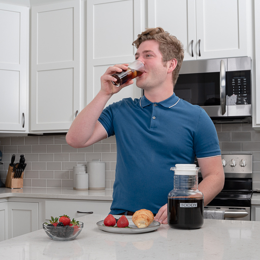 Enjoying cold brew coffee made with the Toddy system